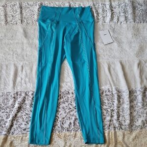 Nike YOGA DRI-FIT High-waisted 7/8 Metallic Trim Leggings - MEDIUM